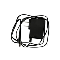Black power adapter with coiled cable on a white background